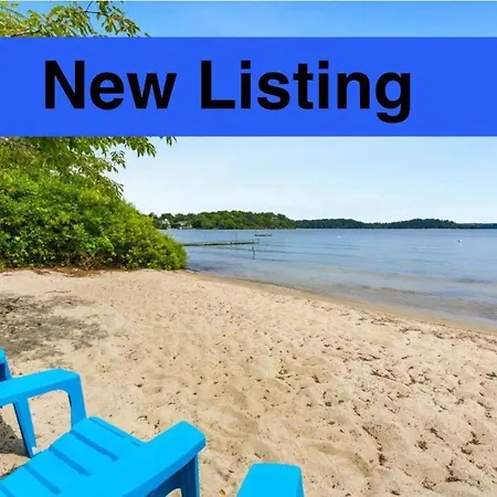 Family Lakeside Escape With Private Beach And Calm Waters